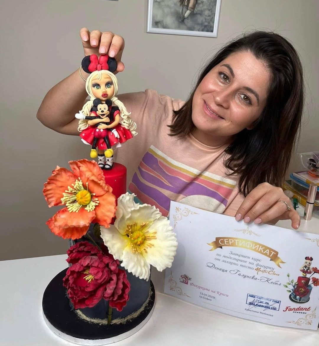 Deni with a sculpted doll cake and her figure-modelling masterclass certificate
